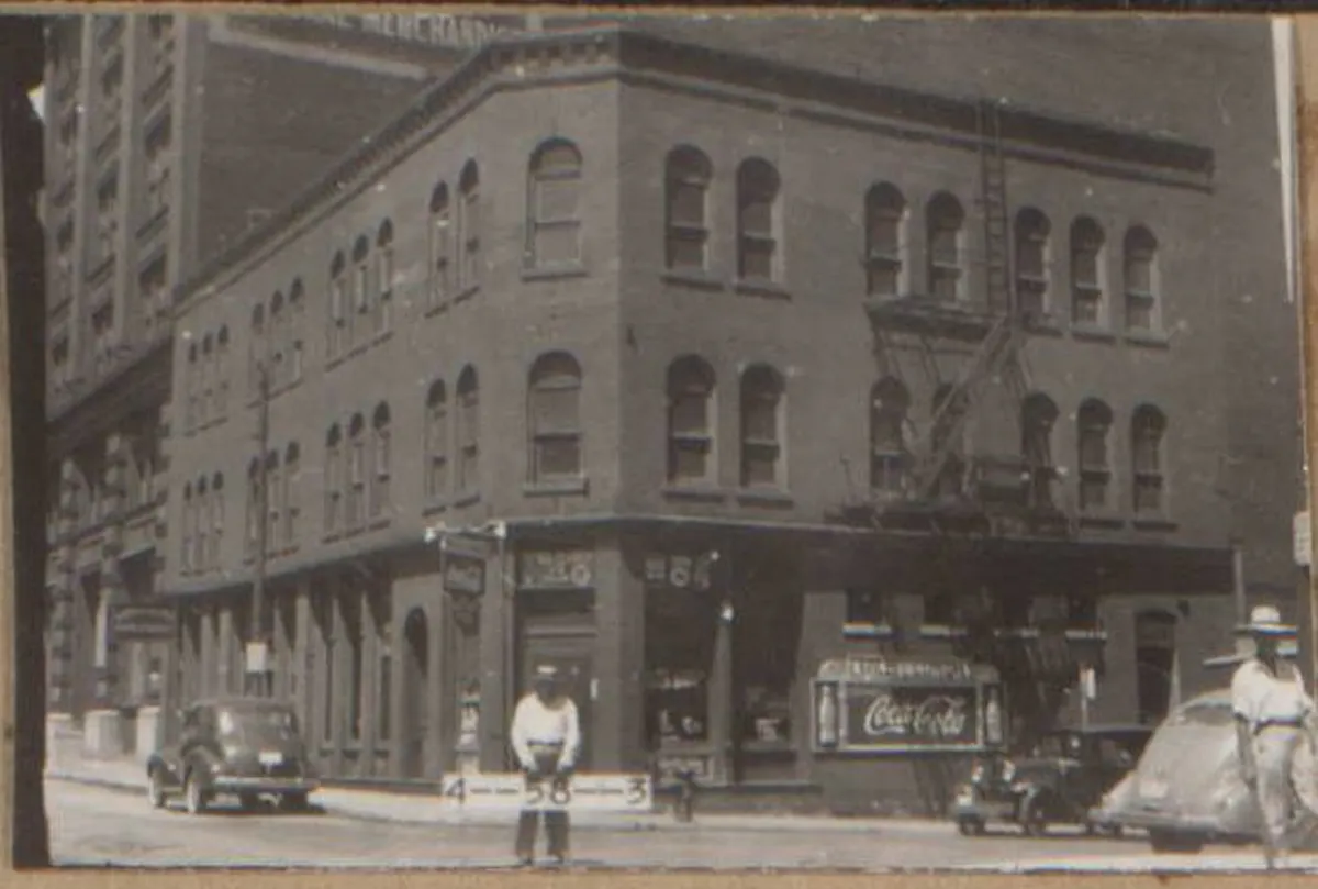 a group of people in front of a building